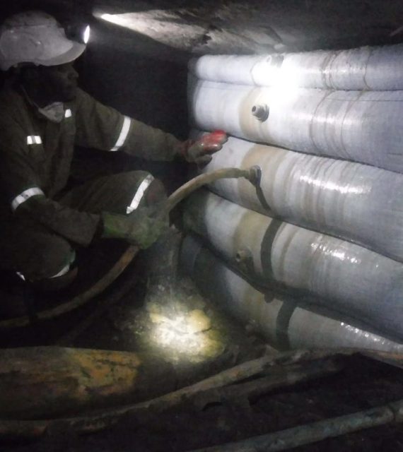 Miner working beside an installed grout pack