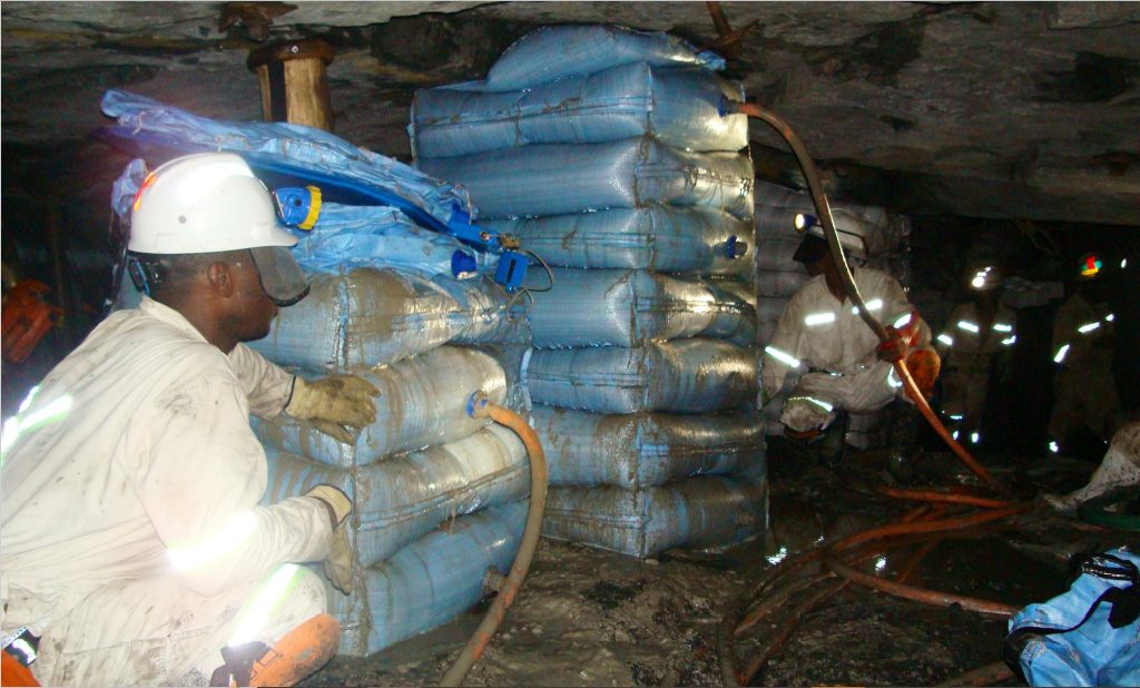 Spirotech crew pumping a grout support pack against the hanging wall of an underground stope